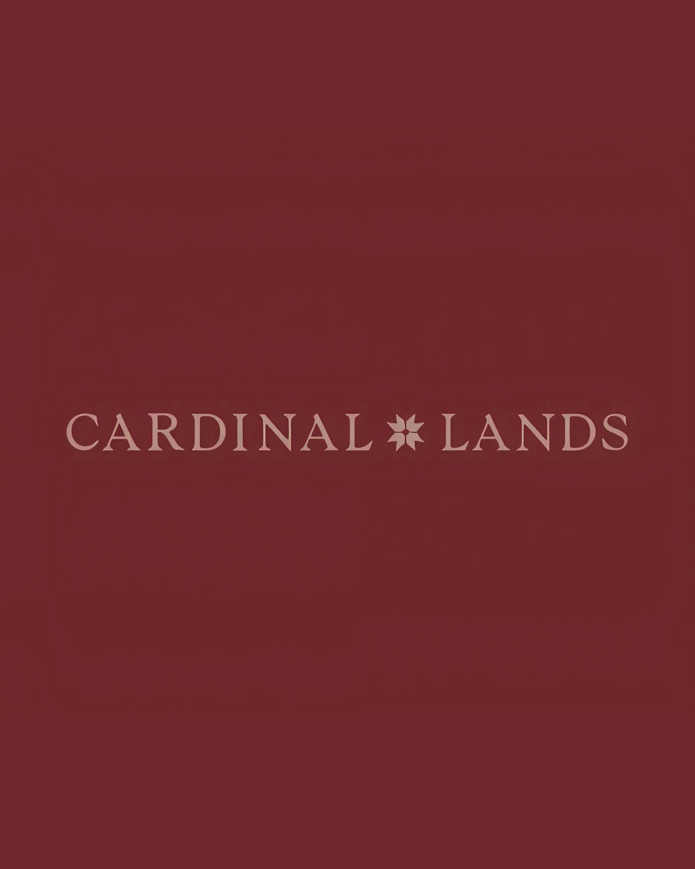Cardinal Lands wordmark and quilt-inspired emblem on burgundy.